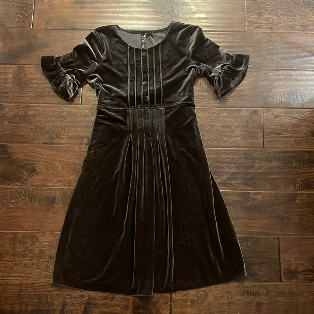 velvet girls dress with ruffled sleeves and button pleat details on front